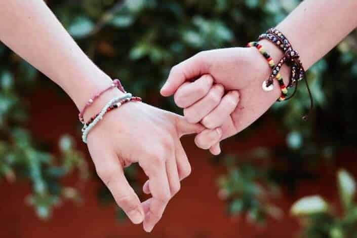 two person holding hands