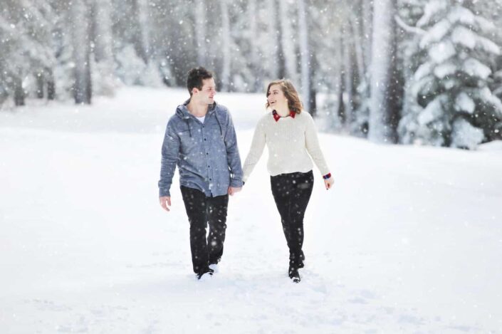 couple holding hands while walking