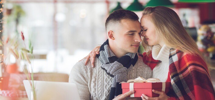 Woman giving her gift to his man