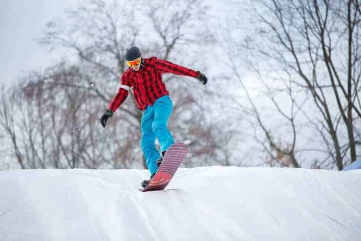 man snow boarding