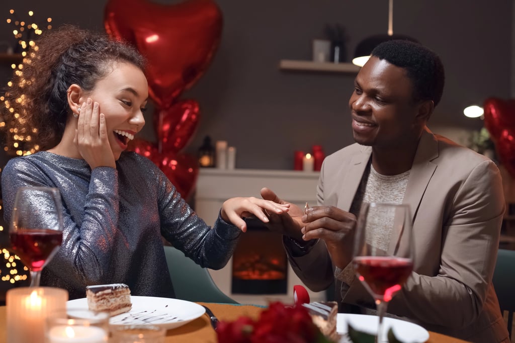 An African-American man proposing to his beloved on Valentine date.