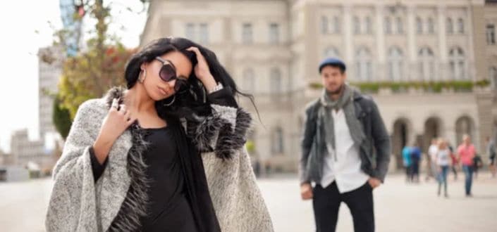 Girl with glasses walking down the street