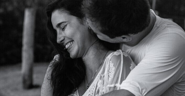 Romantic young couple embracing in park