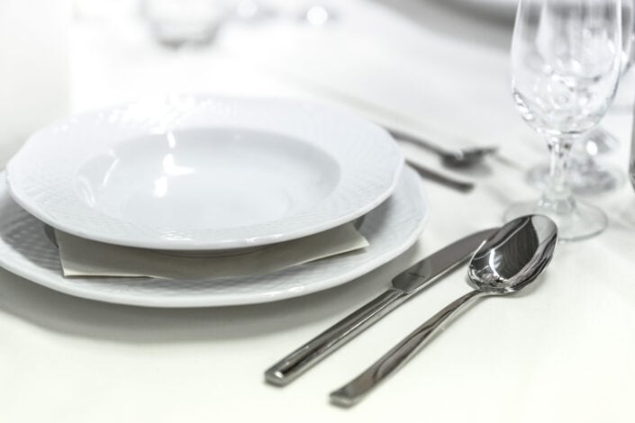 Round white ceramic bowl placed on table