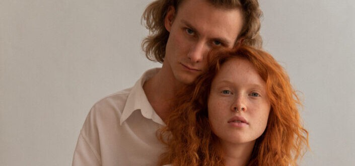 Loving couple embracing gently in studio