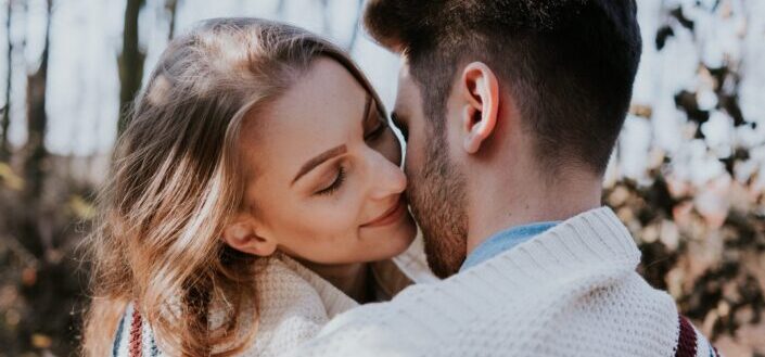 Man and Woman Kissing During Daytime