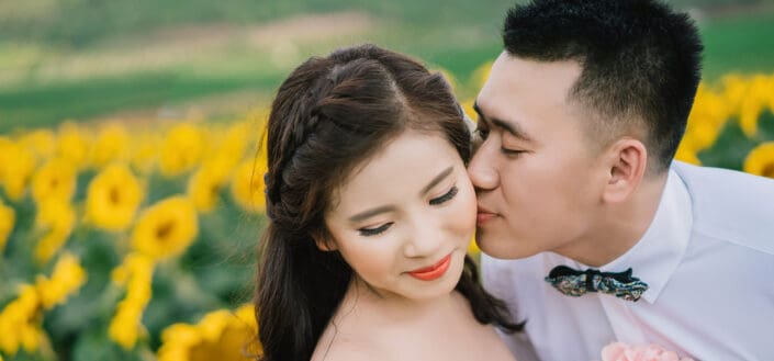 Man Pecking Woman on Her Cheek
