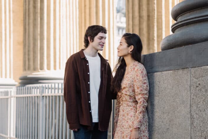 Man and woman standing in colonnade