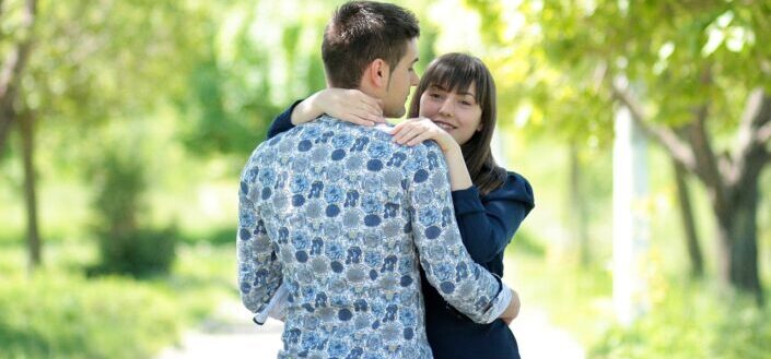 Couple hugging in a park