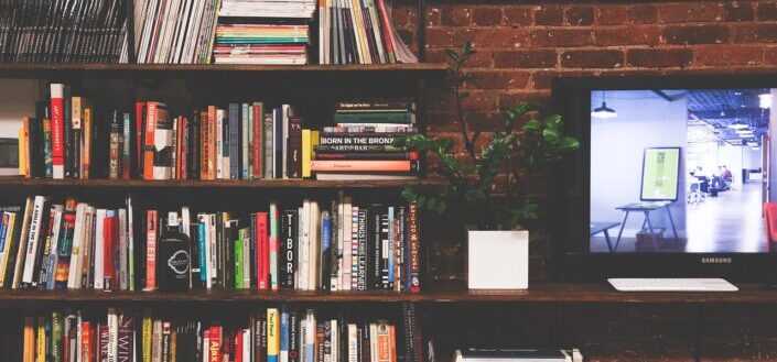 Shelves Filled With Books and Television