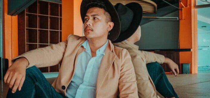 Stylish Man Sitting Near Mirror