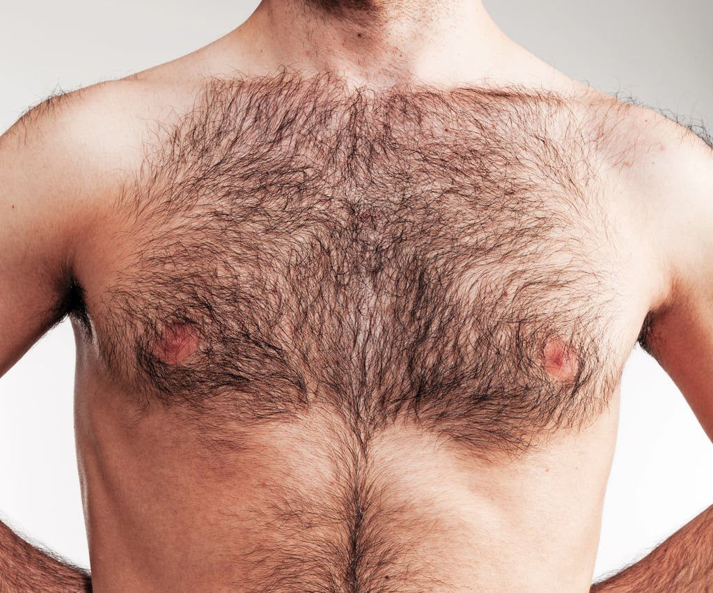 Man with shaped hairline (Defined Border) hairy chest on white background.