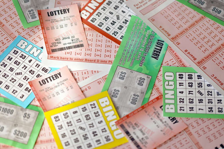 Powerball jackpot tickets and bingo cards for lottery draws