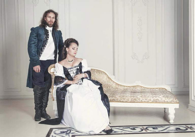 A couple wearing medieval-inspired dresses