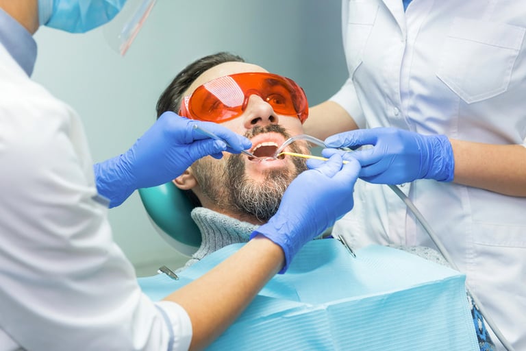 A man undergoing orthodontic evaluation by the best dentist in New York City.