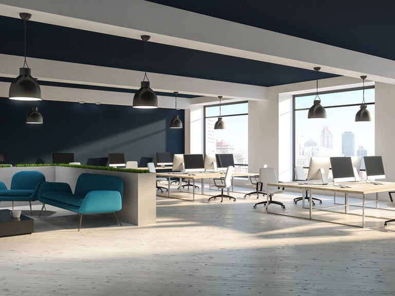 Modern open-plan office design and collaborative seating areas to boost workplace performance and productivity.