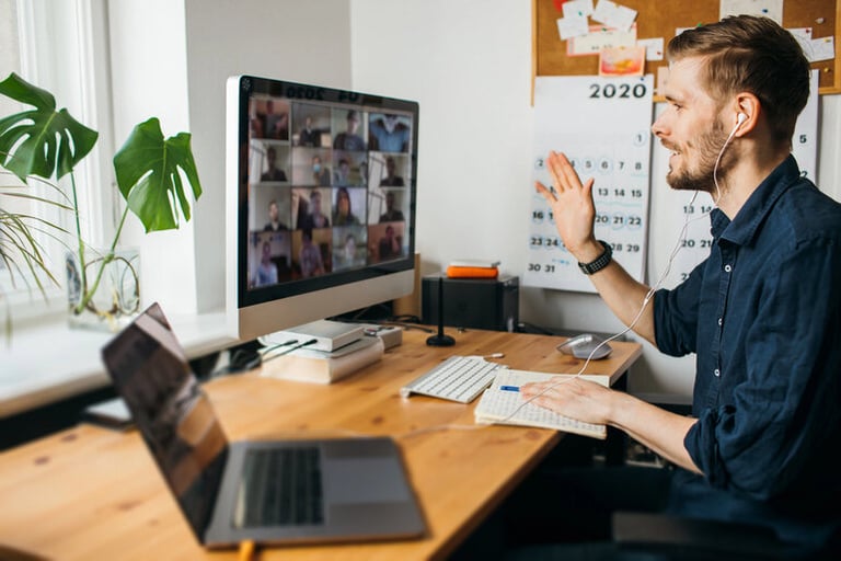 A man is working remotely using a computer