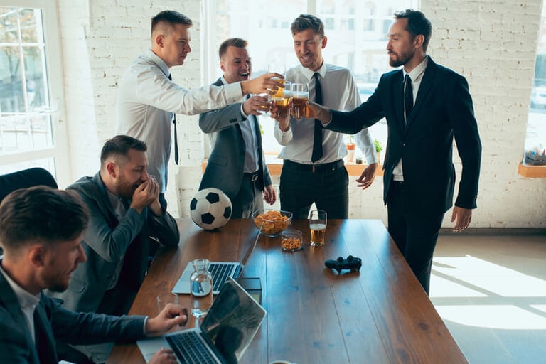 Group of colleagues in a conference room drinking together in honor of some achievement.