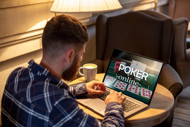 A man playing poker on a laptop