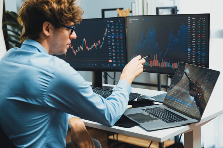 Young investor analysing big tech stocks and market trends on a digital screen