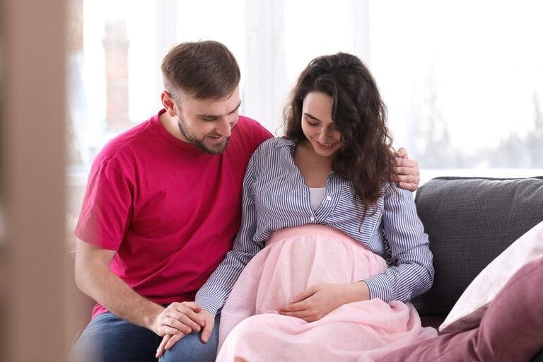 A man and woman sitting together, showing emotional support and partnership during recovery after a birth injury.