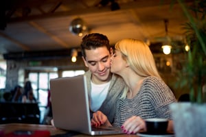 A man and woman meet using an online dating platform, illustrating how good Elenadate's features and secure daily use are.