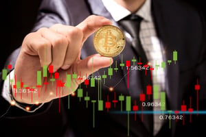 Business professional holding a Bitcoin coin in front of a cryptocurrency price chart, illustrating Bitcoin's transition toward a more orderly and mature market phase.