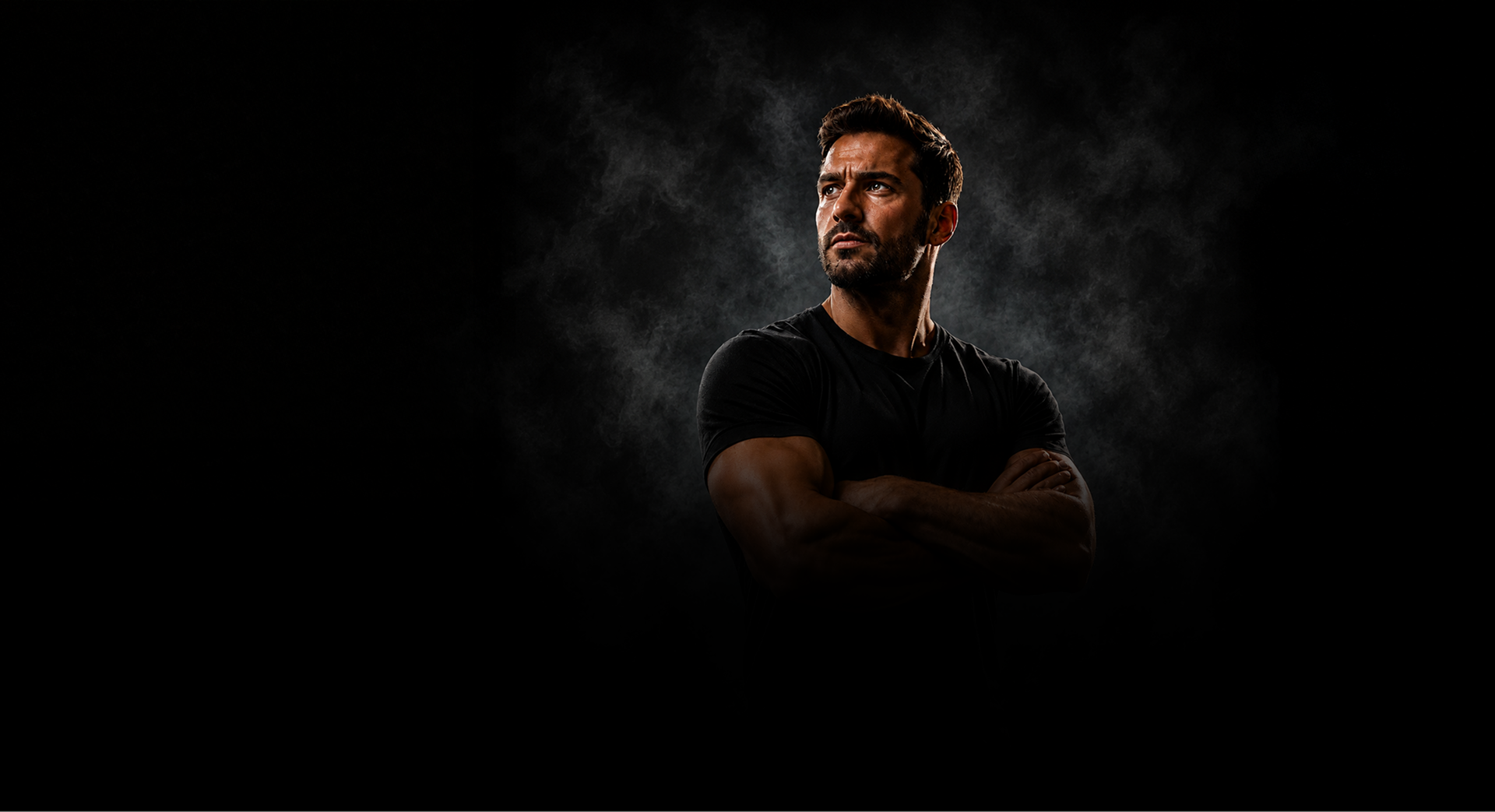 Masculine man shrouded in energy against a black background