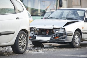 Two cars involved in a road accident after one driver is hit by an uninsured motorist.