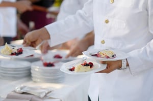 Chef plating scoops of ice cream for a private event dessert catering service.
