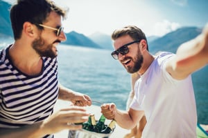 Two friends enjoying a bachelor party celebration while exploring the latest bachelor party travel trends in the United States.