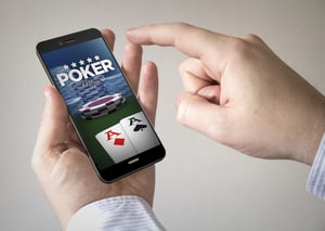 Online casino platforms displayed on a smartphone and laptop.