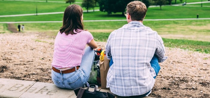 Couple sitting on the ground