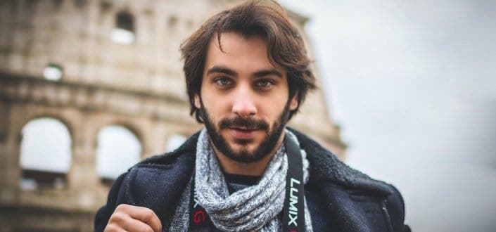 young bearded man looking at camera