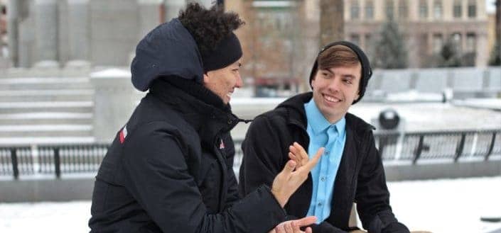 Young men talking outside