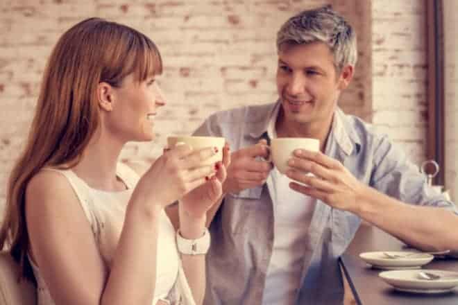 Man and woman having coffee together. - personal questions