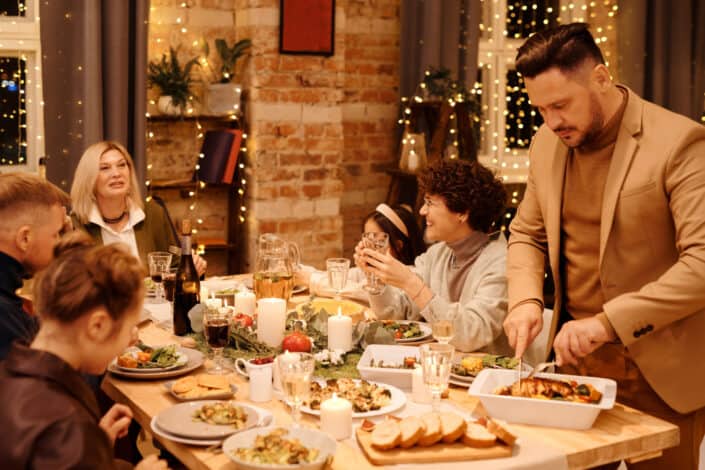 a family laughing together over dinner