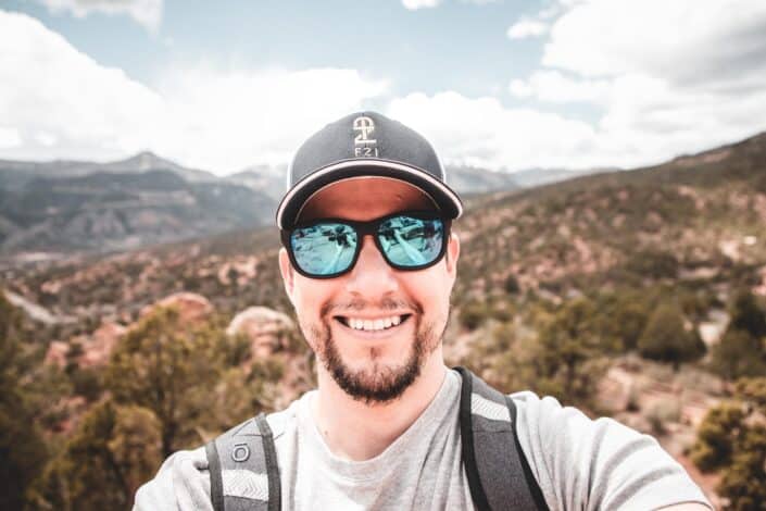 A man taking a selfie with a beautiful background