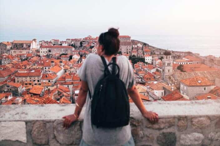 Woman looking at buildings