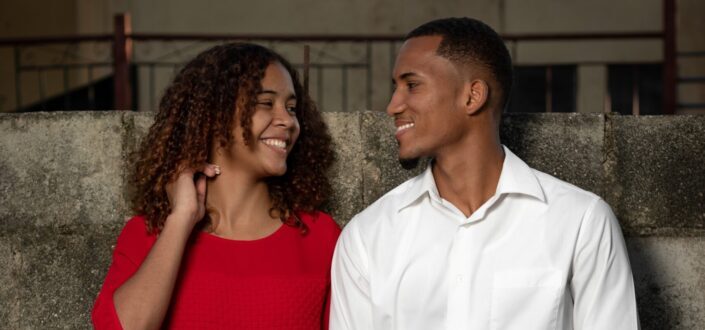 A couple smiling at each other.