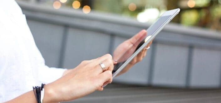 Cropped woman holding a tablet