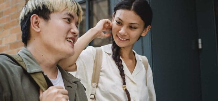 smiling woman staring to man