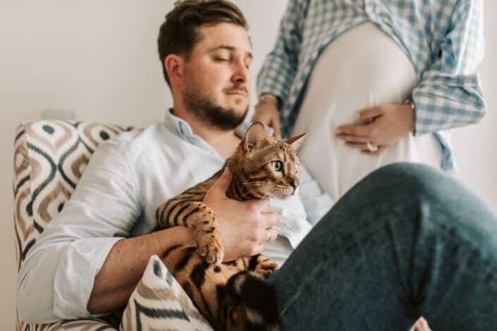 husband holding a cat