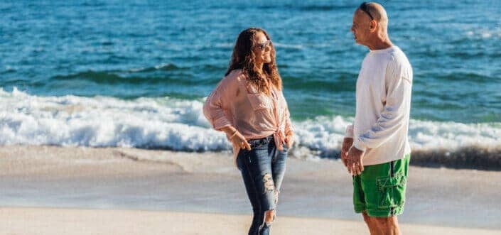 Couple talking at the beach.