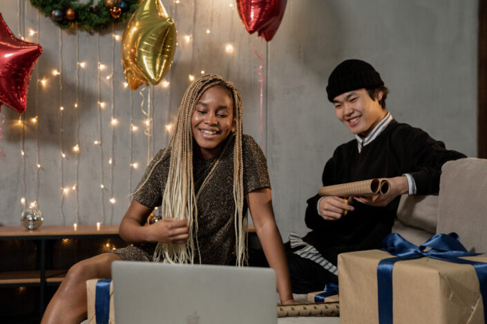 Man and woman delightedly checking out gifts.