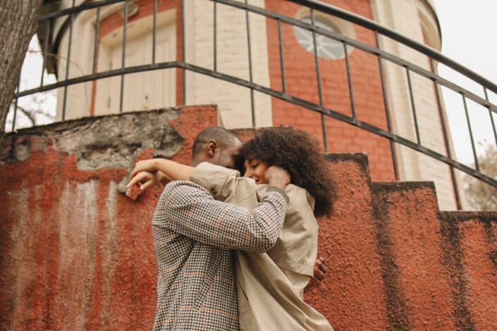 Man and woman hugging.