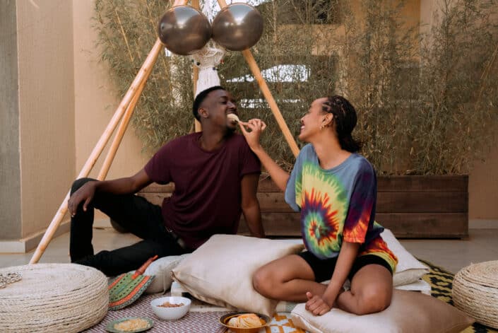 Woman Feeding Man a Potato Chip