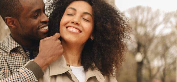 Man Hugging Woman from Behind