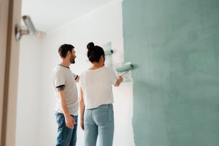 couple painting the wall together