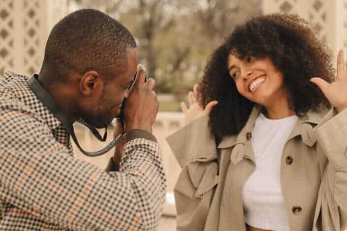 Man Taking Picture of Woman